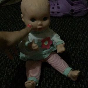 This is a toy it is 11 inches tall skin is white !